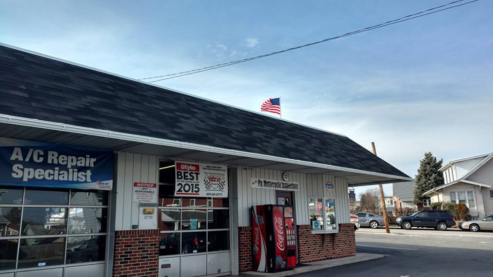 auto repair shop new gutters installed